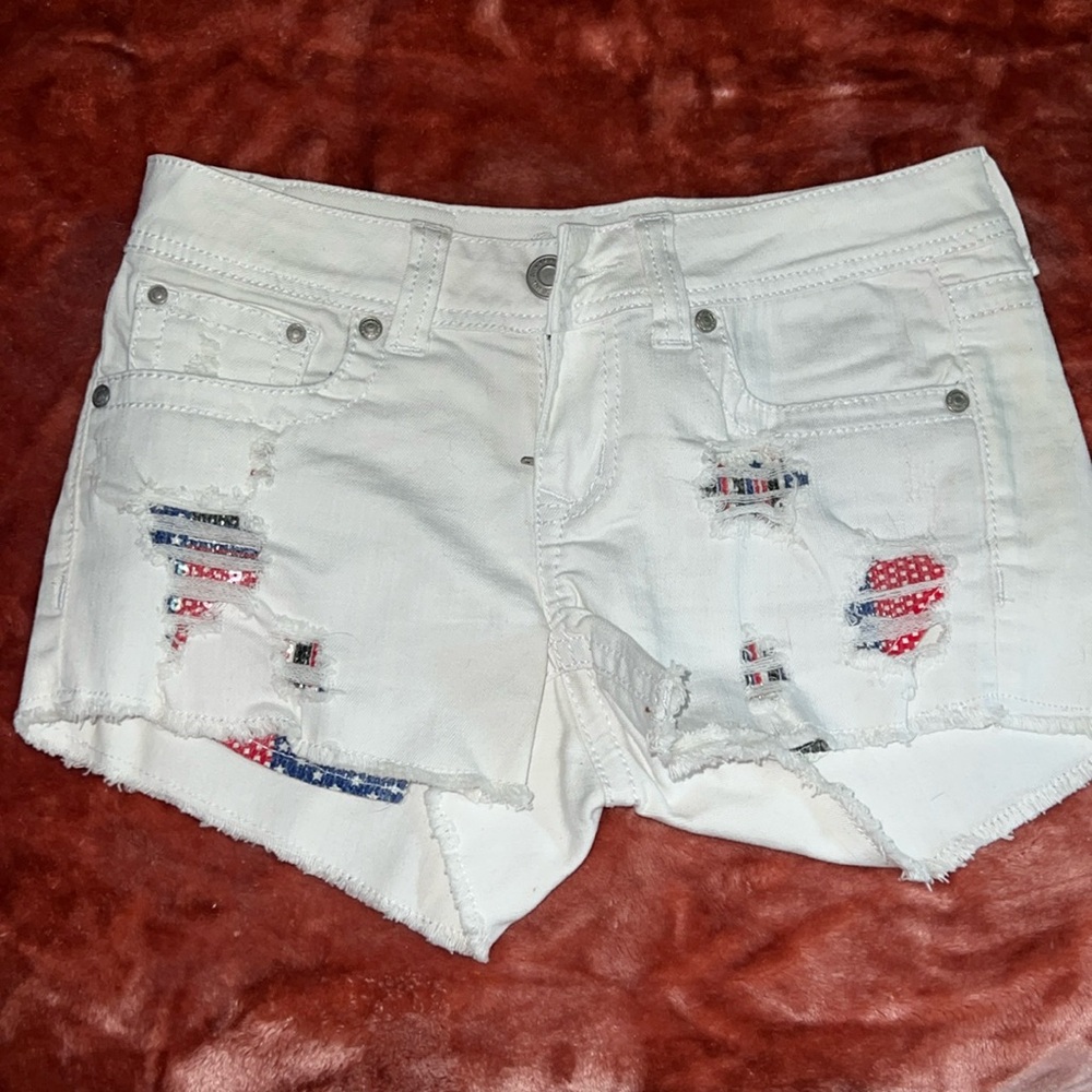 White jean shorts with American flag pockets